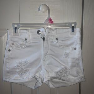 White ripped jean shorts
